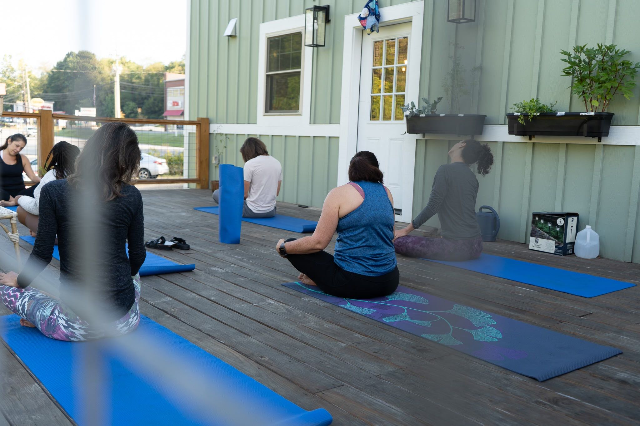 Outdoor yoga class at The Lazy Tiger